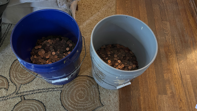 The penny jar with about 18,000 pennies in it
