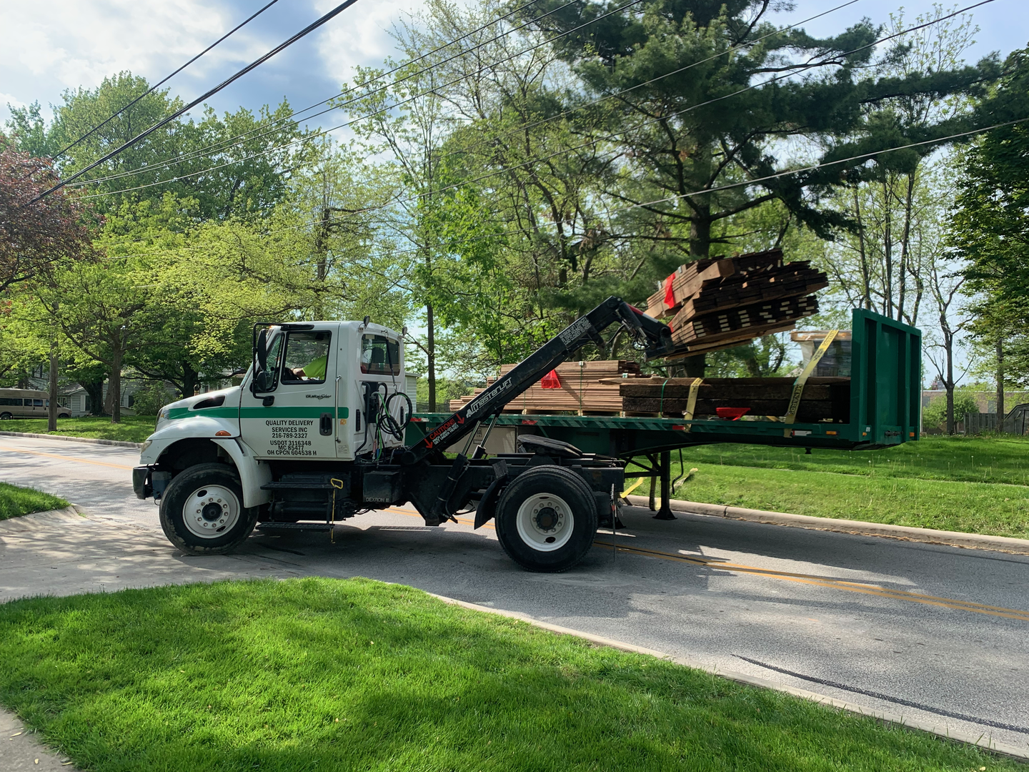 But the wood did eventually arrive! (And they blocked the whole street while they unloaded it.)